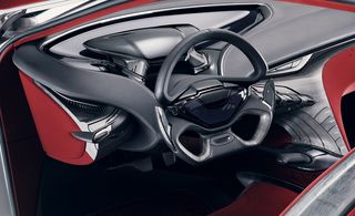 Inside, the dashboard features a floating acrylic instrument cluster with multilayered projection