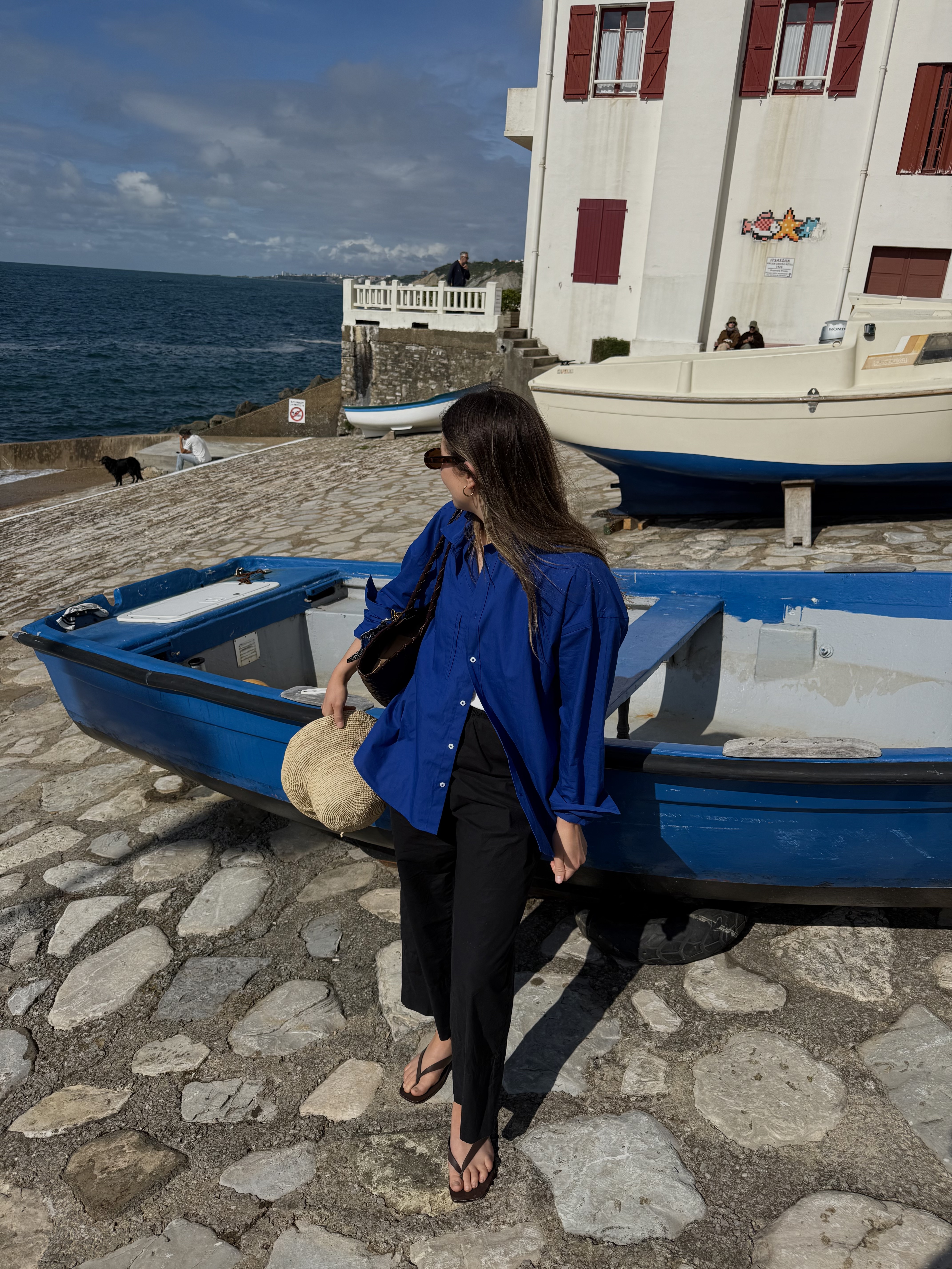 Emily Dawes wears A.emery Kinto flip flops for summer 2026