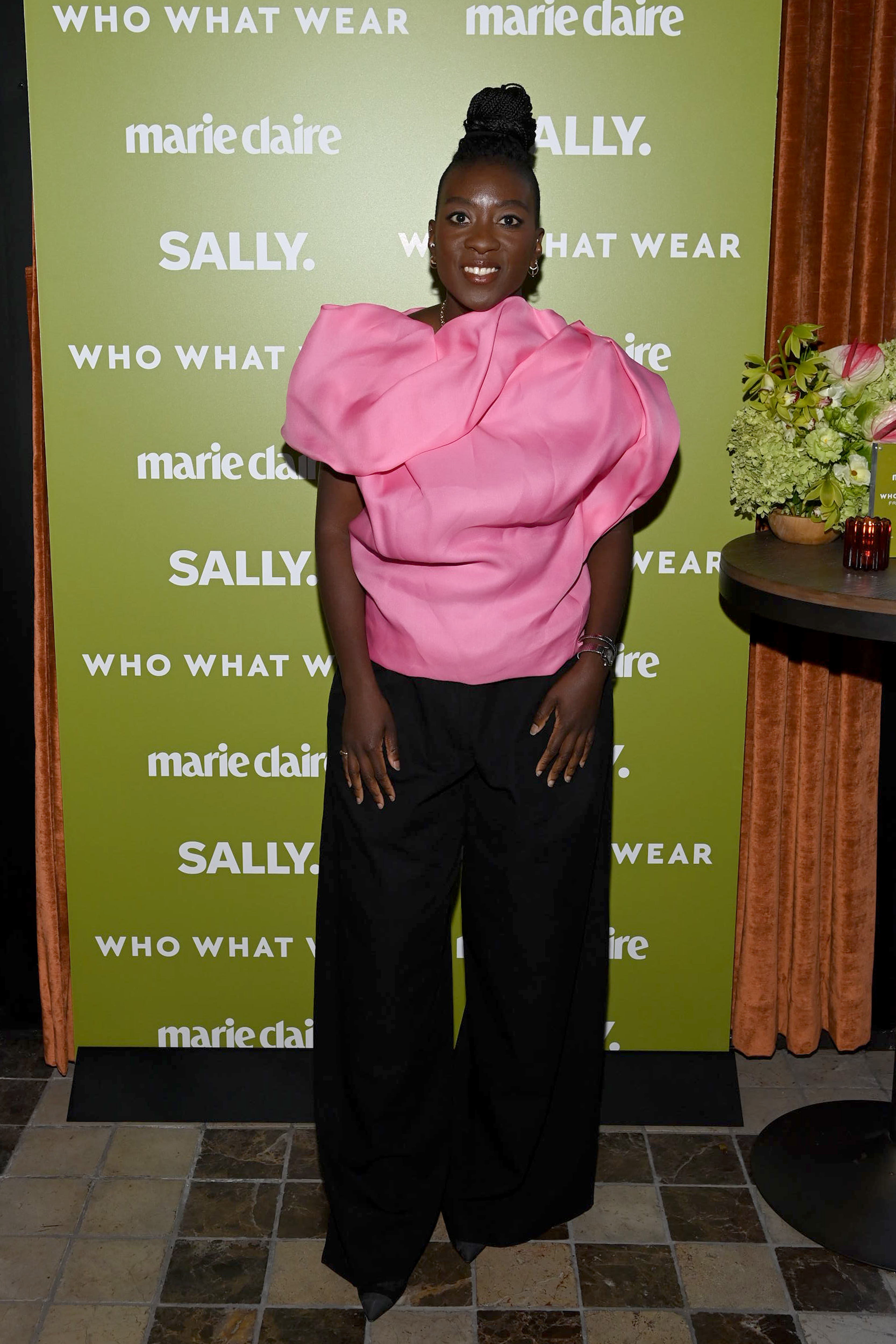 Nikki Ogunnaike wearing a pink top and black pants at Marie Claire&#039;s Power Play