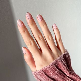 Hand manicured with metallic dots