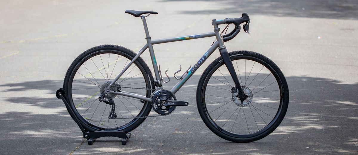 A silver Moots Routt RSL bike stands free in a car park