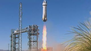 a white rocket lifts off from the Texas desert under a blue sky