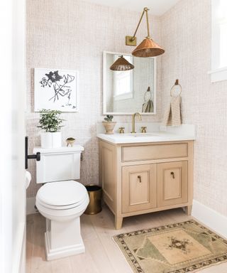 Pine bathroom vanity unit with white fixtures, wooden floors and frame on the wall