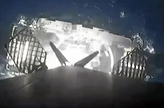 A SpaceX Falcon 9 rocket's first stage approaches a landing on the droneship Just Read the Instructions after launching 23 Starlink satellites on Wednesday, Nov. 8, 2023.