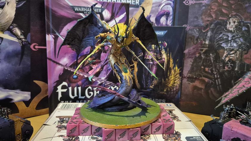 Warhammer 40,000 Fulgrim model on top of Emperor&#039;s Children dice, in front of Codexes and artwork for the faction