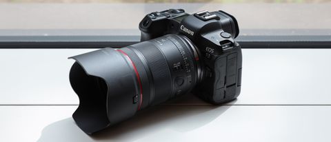 Canon RF 35mm f/1.4L VCM lens attached to a Canon EOS R5 camera on a white surface in front of a window