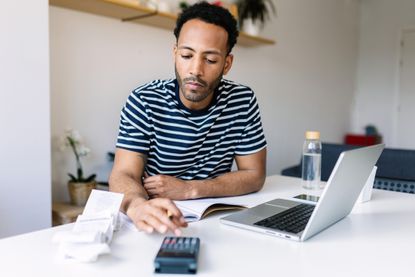 Man checking business rates bill on a laptop