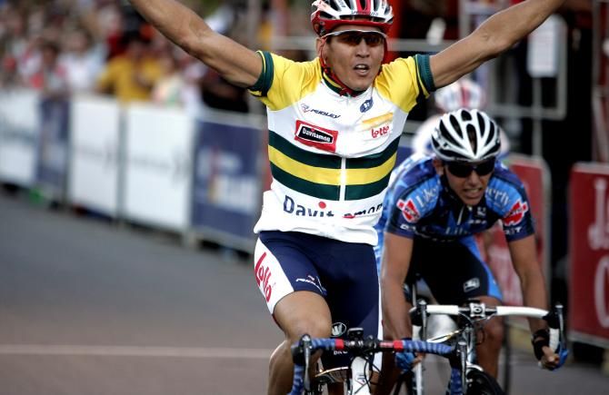 Robbie McEwan celebrates after winning the opening stage
