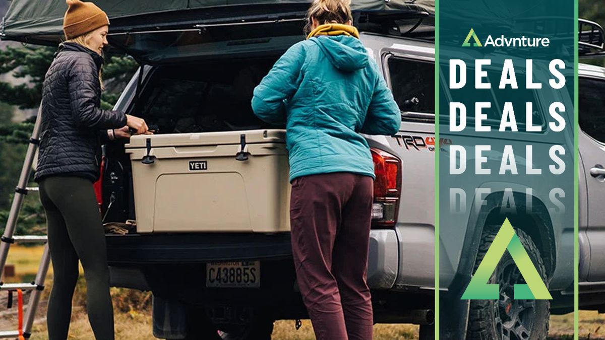 Women putting Yeti cooler in truck