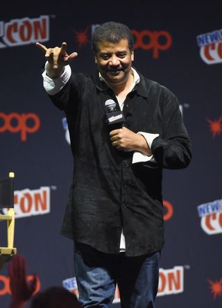 Neil deGrasse Tyson speaks on stage at New York Comic Con's "StarTalk" panel on Oct. 6.