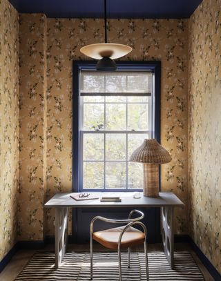 Home office with yellow wallpaper