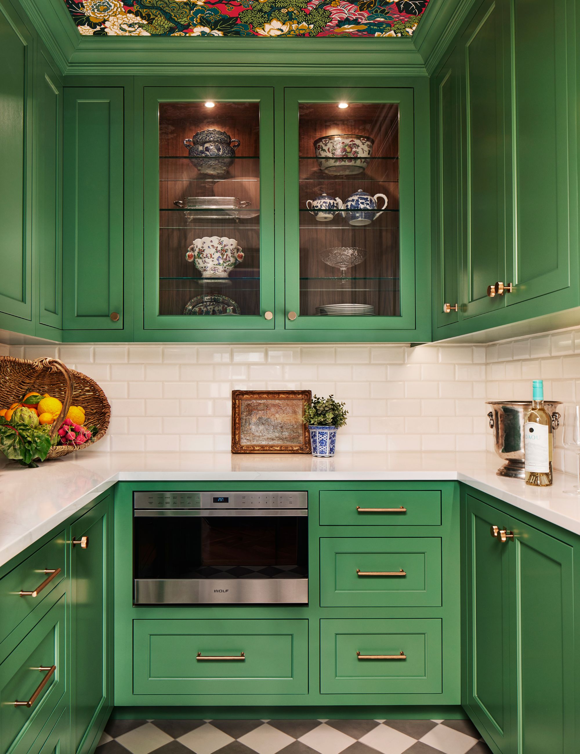 Green back kitchen with floral wallpaper on the ceiling
