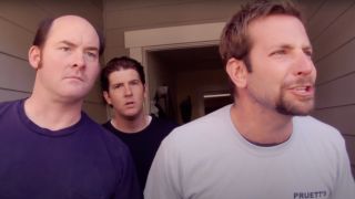 Bradley Cooper argues while David Koechner and Nate Tuck watch from behind in Brother's Justice.