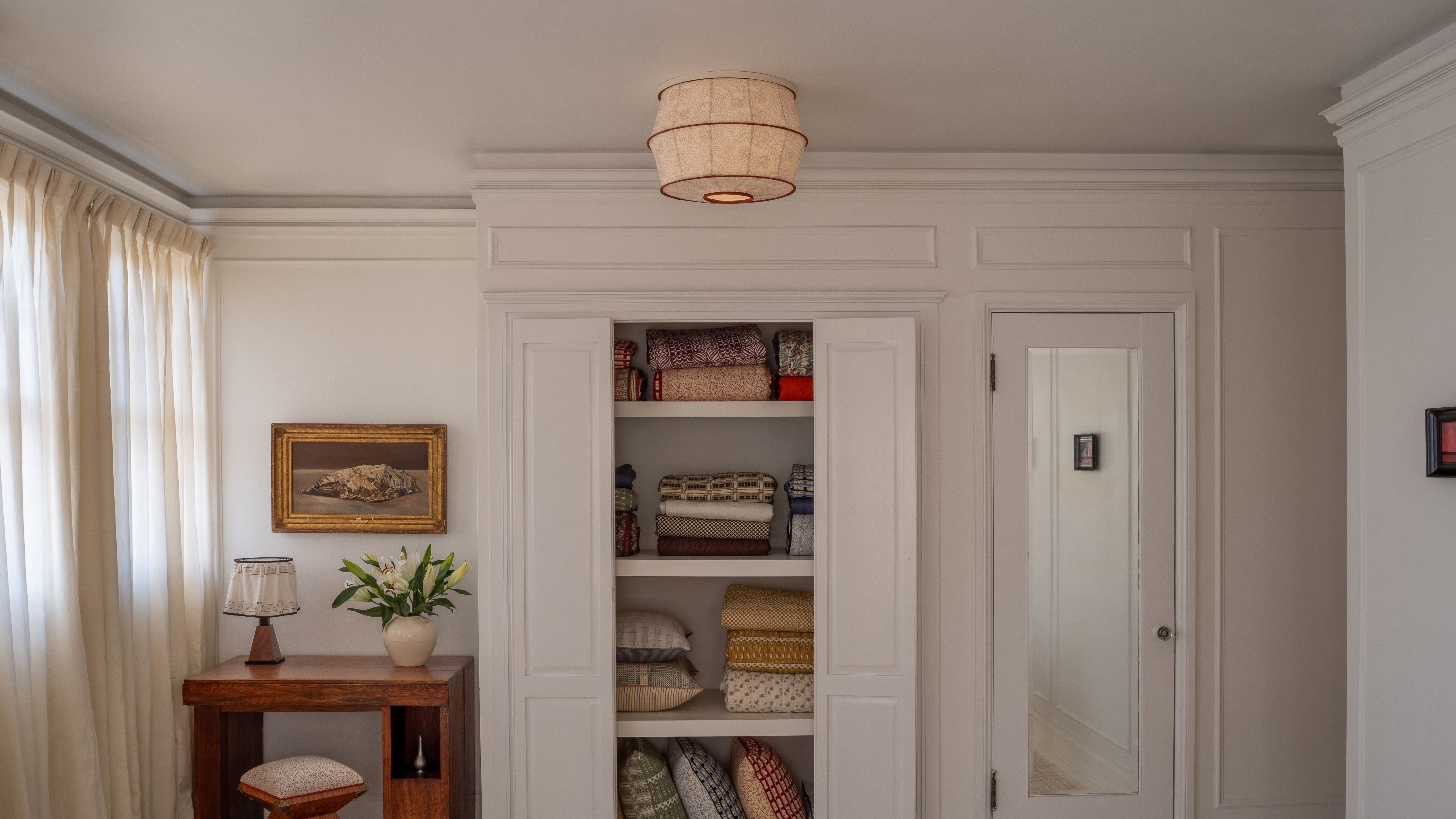 Gem Tuberose light cover by Tulip Shades styled in an NYC bathroom