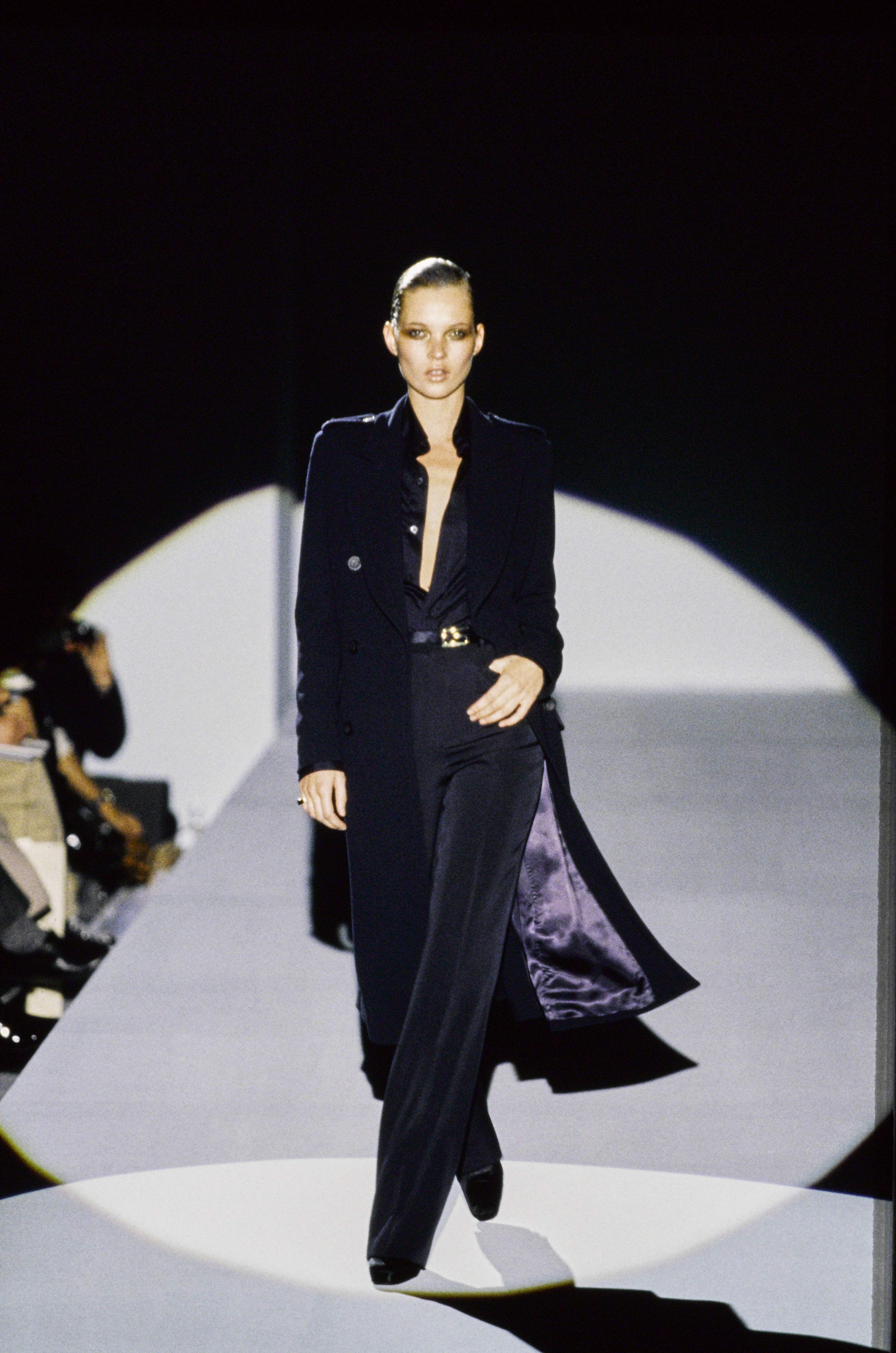 An image of Kate Moss wearing Tom Ford for Gucci cigarette trousers from 1996.