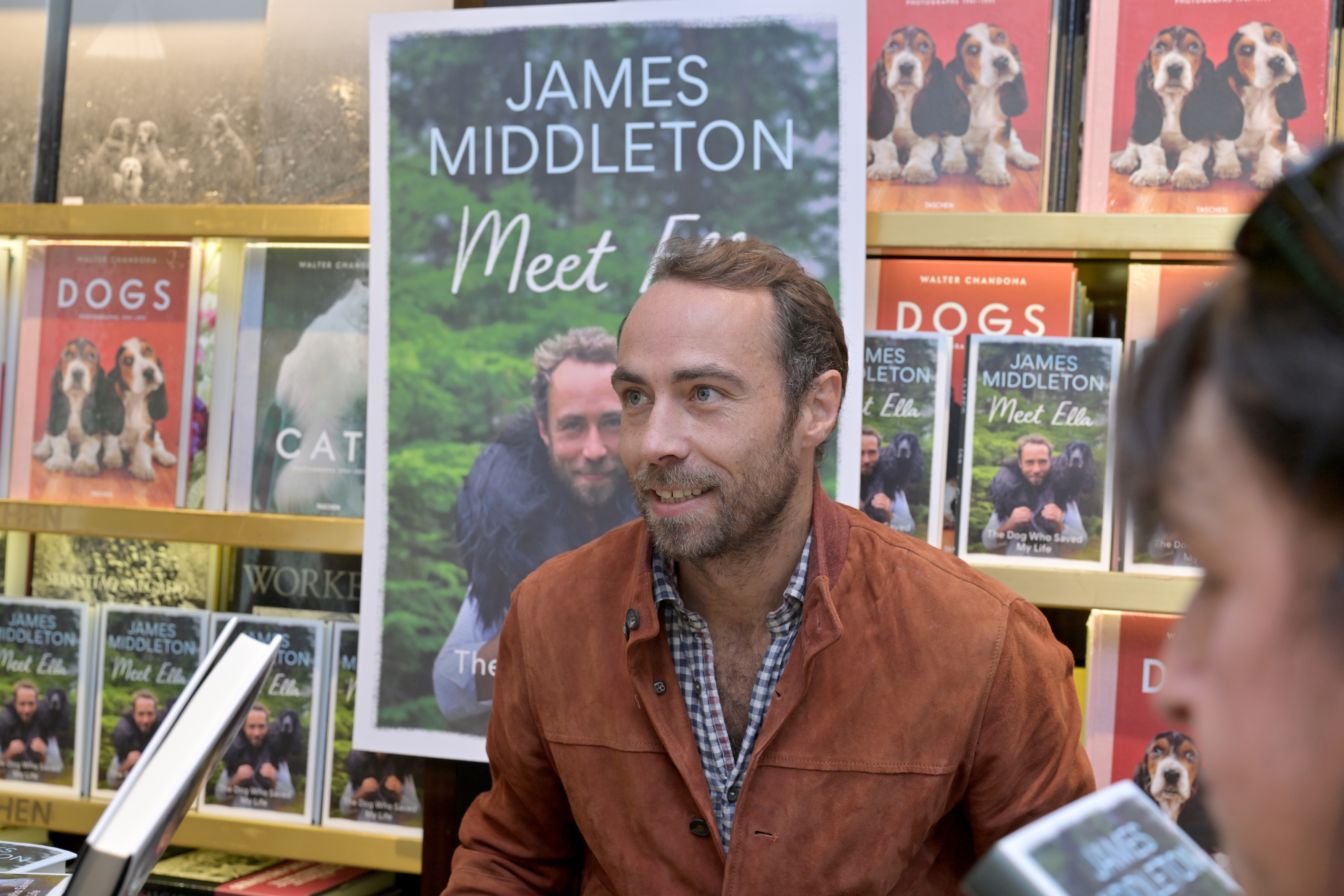 James Middleton talking to fans at a book signing for his book Meet Ella