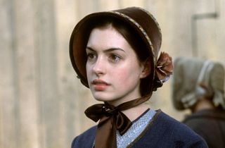 Anne Hathaway wears a bonnet and period clothing in 'Nicholas Nickleby'