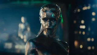 A silver-skinned female superhero hovering over a city scape