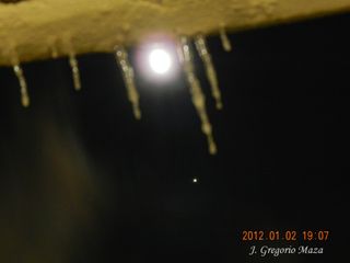 Skywatcher Greg Maza of Ontario, Canada snapped this view of Jupiter and the moon through icicles on a chilly Jan. 2, 2012 as the two objects appeared close in the night sky.
