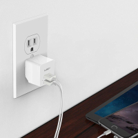 This tiny wall charger takes up barely any space in your bag and can charge two devices at the same time.