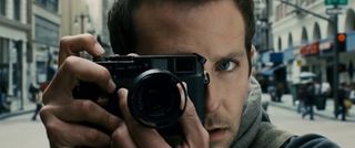 Bradley Cooper holding a camera