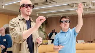 Snapchat Spectacles being worn on person playing around with others in an office space