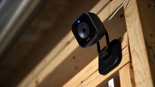 Vivint Indoor Plus camera attached to wooden house frame