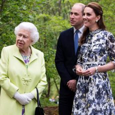 Kate Middleton shows Prince William and the late Queen Elizabeth II around her 'Back to Nature Garden' at the Chelsea Flower Show
