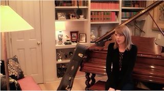 taylor swift in music room with grand piano