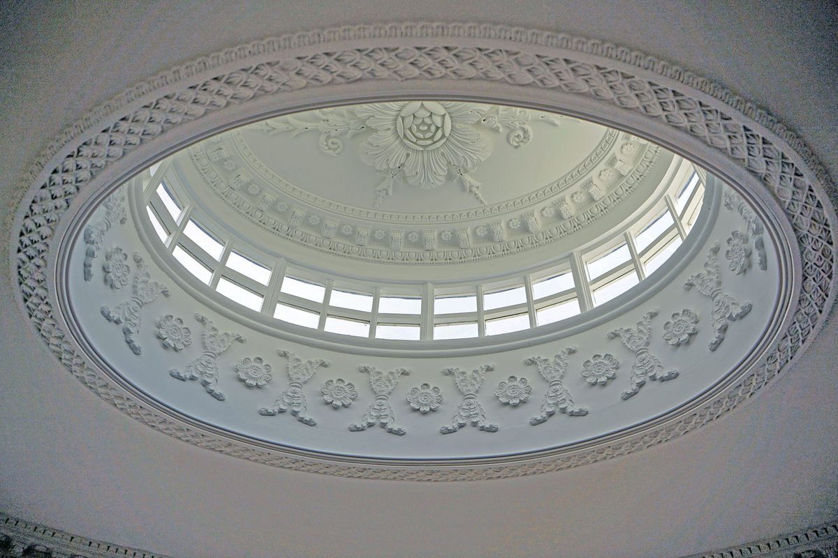 An ornate roof light painted in white