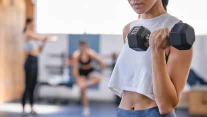 Woman doing a dumbbell curl