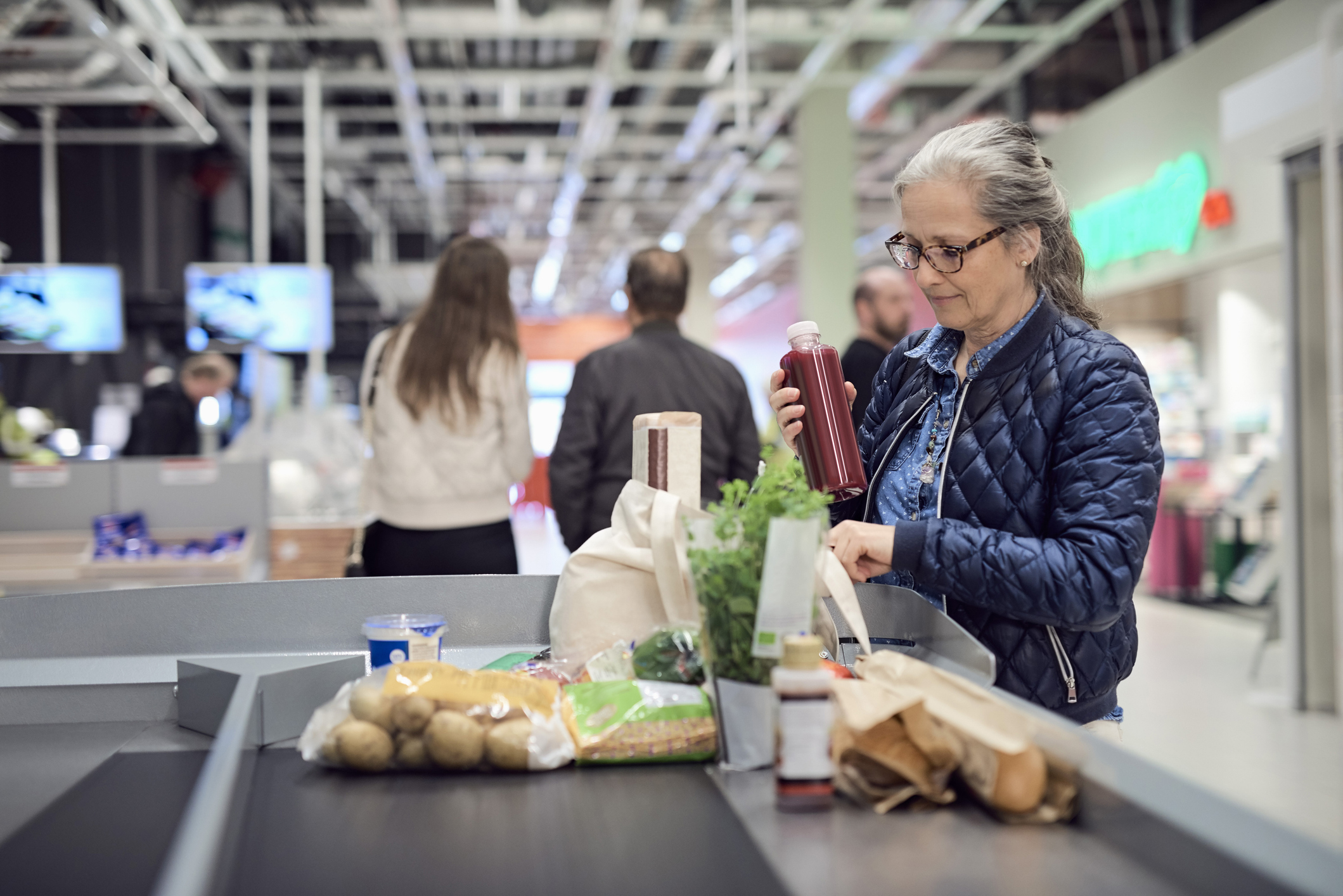 Older woman grocery shopping