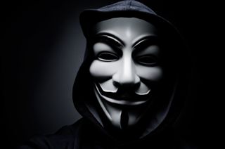 A person wearing a Guy Fawkes mask as a symbol of the Anonymous hacking collective