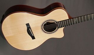 This Grand Concert sized Model E features cocobolo and European spruce tonewoods.
