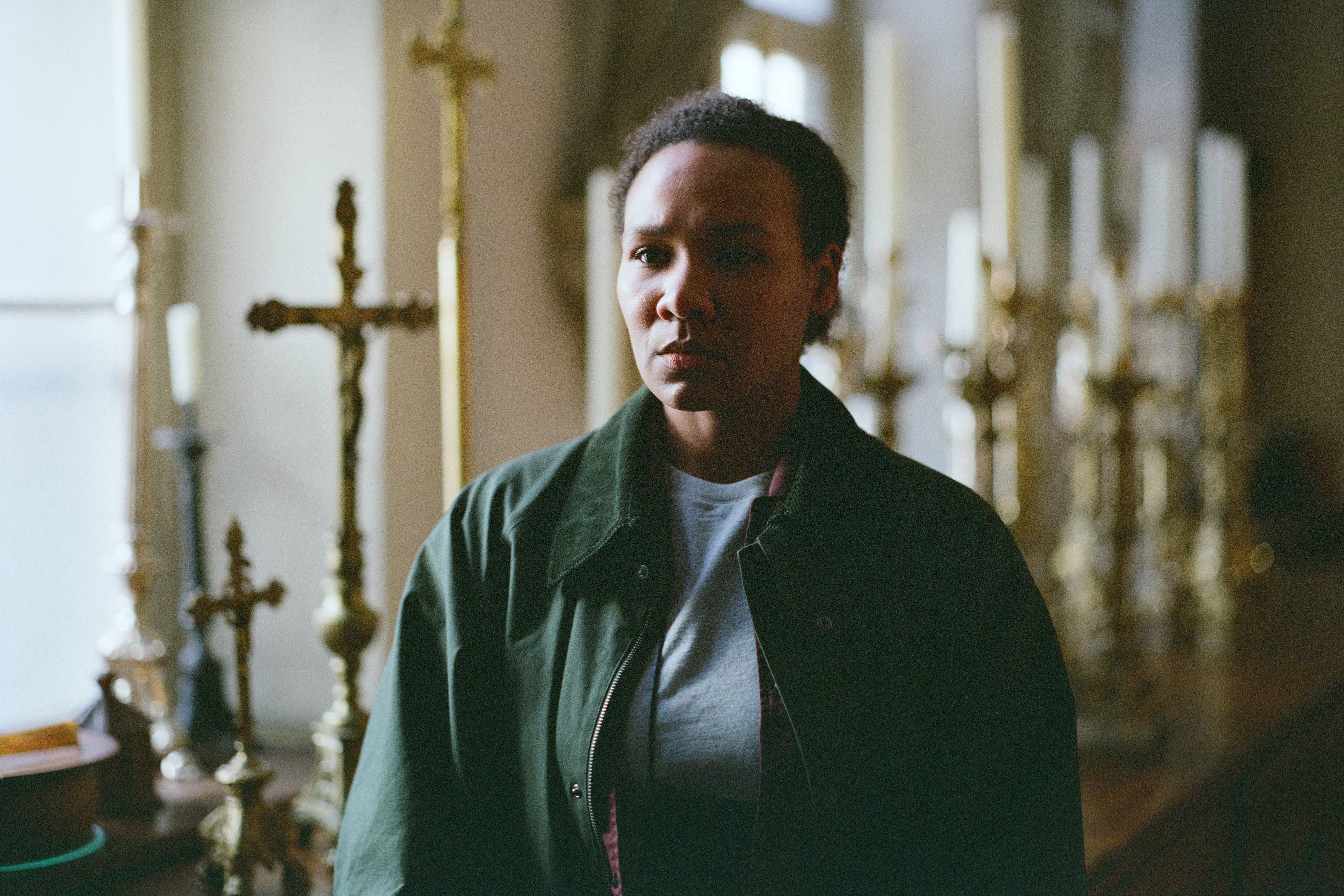 Aicha in a church in Secrets We Keep