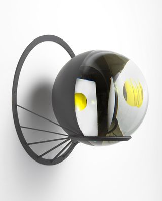 Glass sphere, silver, paint black, yellow, stainless steel.