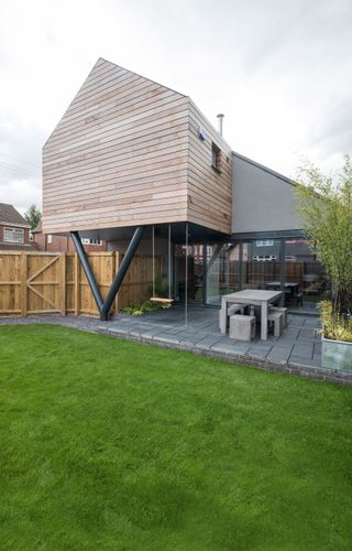 cantilevered extension with contemporary wooden cladding photographer by jeremy philips