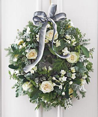 christmas decoration with white roses wreath