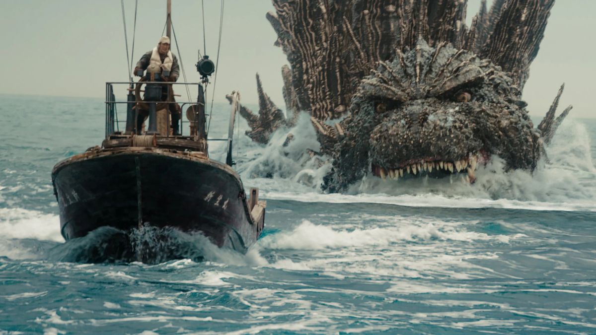 Godzilla Minus One movie still showing a monster chasing a fishing boat