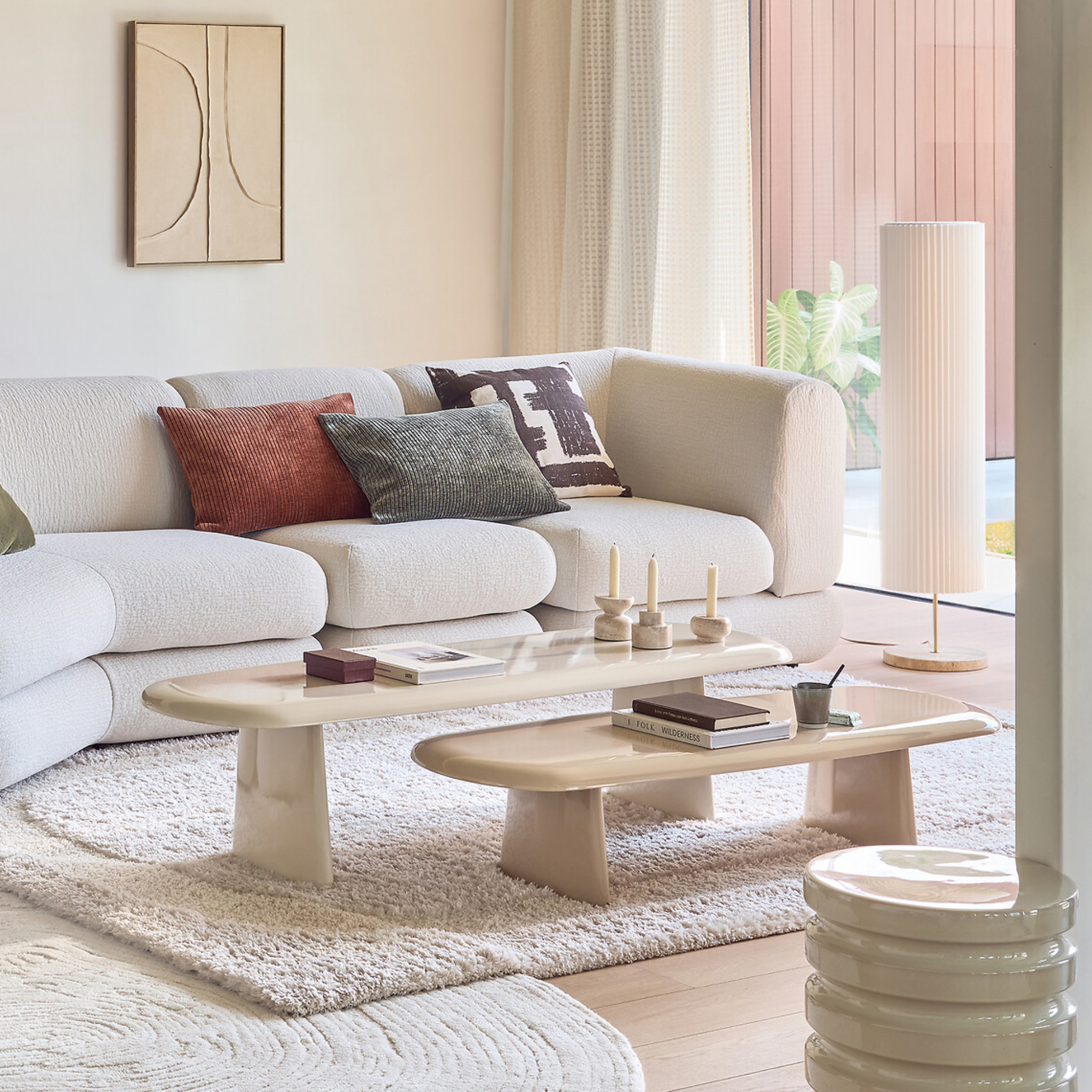 neutral living room with cream sofa and two long coffee tables