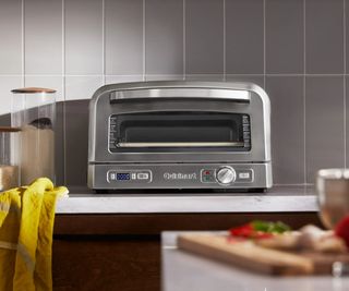 A Cuisinart indoor pizza oven on a countertop