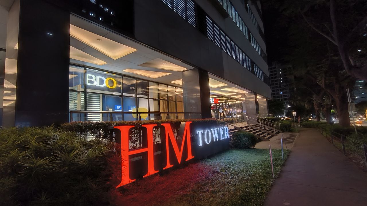 Night shot of a building facade and pavement