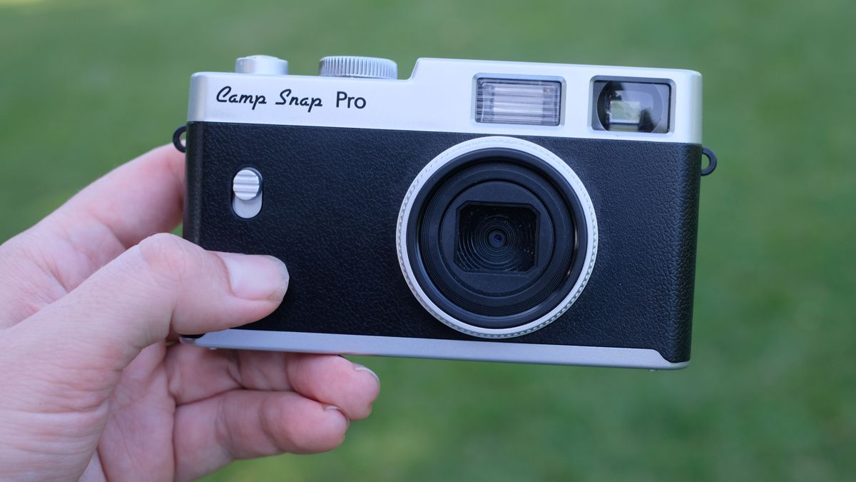 Photograph of Camp Snap CS-Pro digital compact camera held in hand, facing front