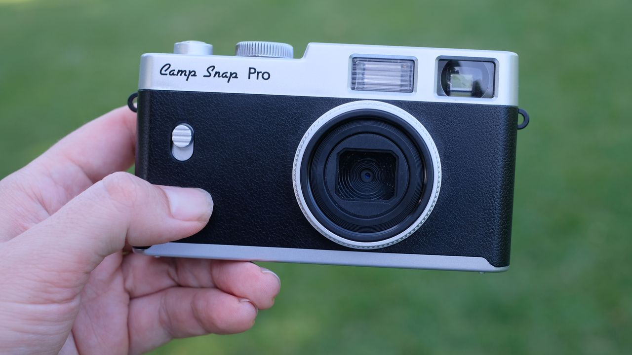 Photograph of Camp Snap CS-Pro digital compact camera held in hand, facing front
