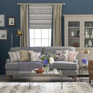 Stylish living room with blue sofa