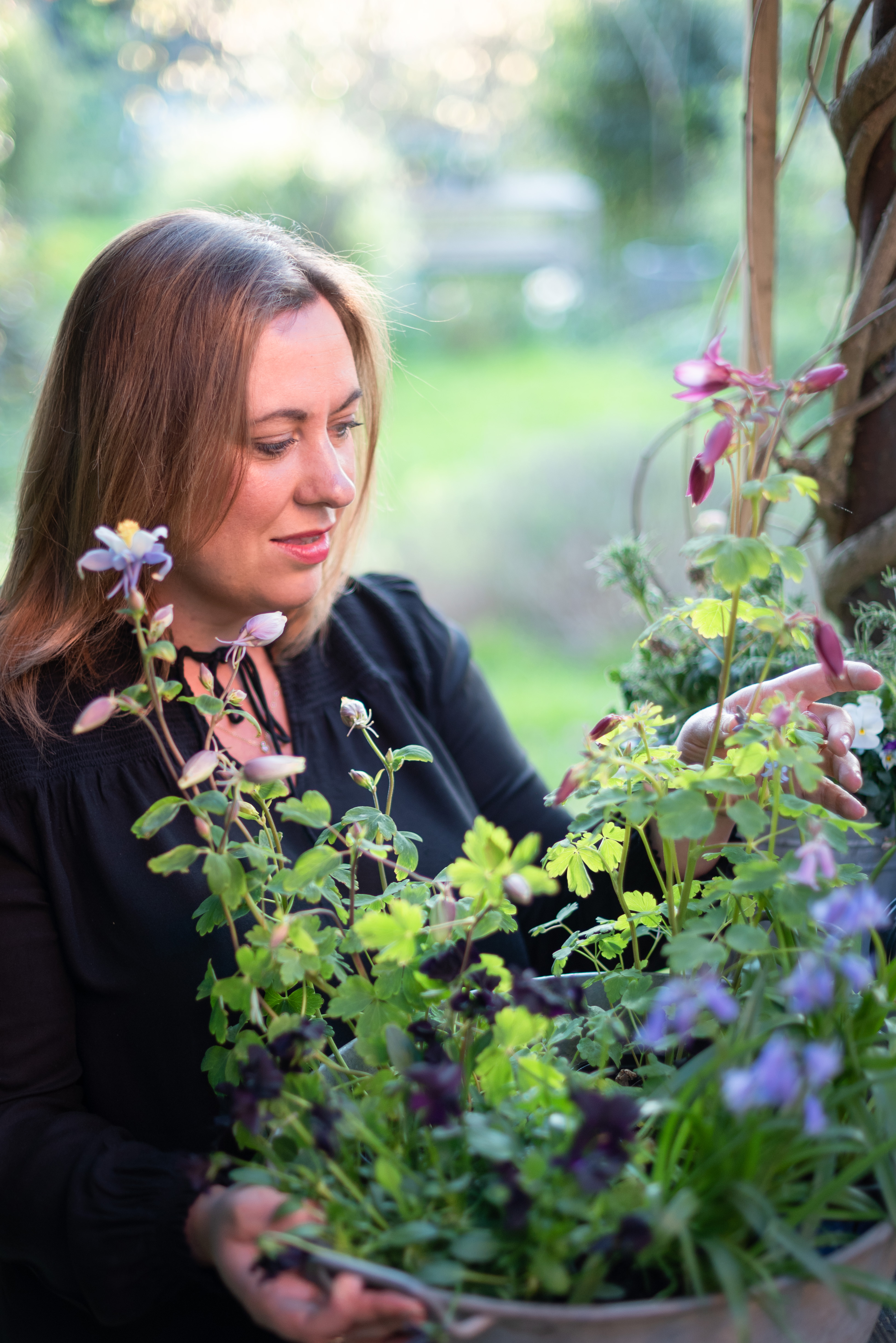 Stylist Selina Lake with a pot of plants