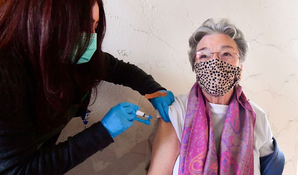 A woman receives her COVID-19 vaccine.