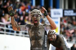 ROUBAIX FRANCE OCTOBER 03 Sonny Colbrelli of Italy and Team Bahrain Victorious covered in mud celebrates winning in the Roubaix Velodrome Vlodrome Andr Ptrieux during the 118th ParisRoubaix 2021 Mens Eilte a 2577km race from Compigne to Roubaix ParisRoubaix on October 03 2021 in Roubaix France Photo by Tim de WaeleGetty Images