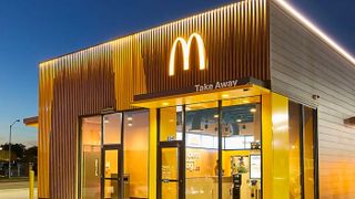 Exterior of McDonald's restaurant lit up at night