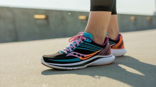 Saucony Kinvara 12 worn by a female athlete